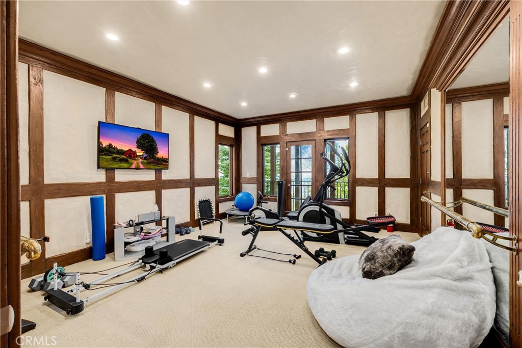 29162 Bald Eagle Ridge Road Lake Arrowhead, CA 92352 - Photo 36 of 69 a room with gym equipment and large window