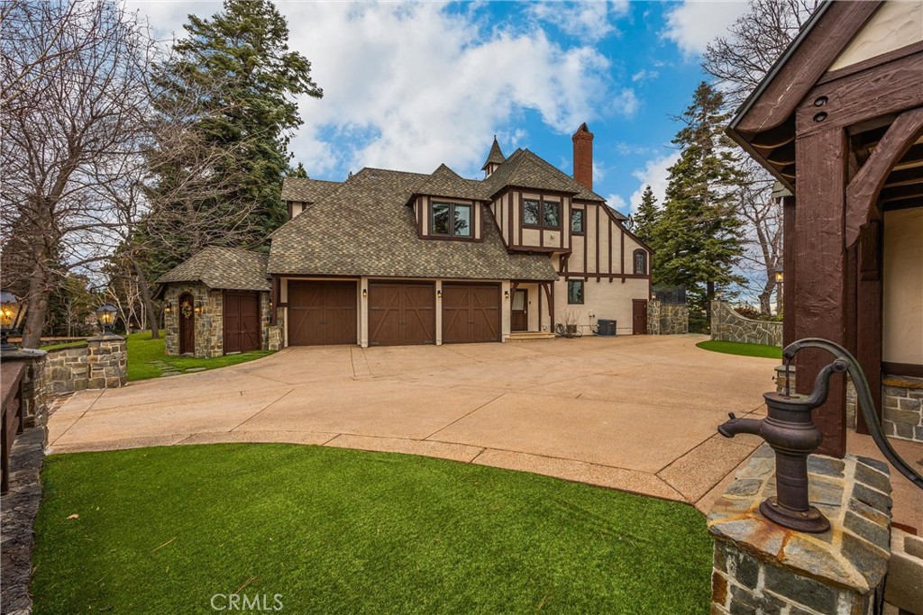 29162 Bald Eagle Ridge Road Lake Arrowhead, CA 92352 - Photo 40 of 69 a front view of a house with a garden