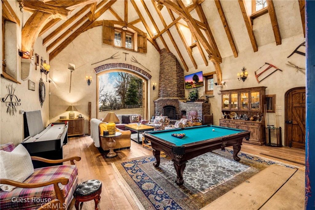29162 Bald Eagle Ridge Road Lake Arrowhead, CA 92352 - Photo 49 of 69 a living room with fireplace furniture and a rug