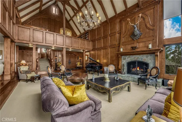 a view of living room with furniture and chandelier