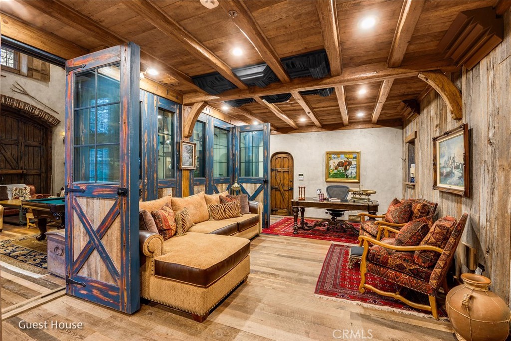 29162 Bald Eagle Ridge Road Lake Arrowhead, CA 92352 - Photo 52 of 69 a outdoor space with patio lots of furniture and a fireplace