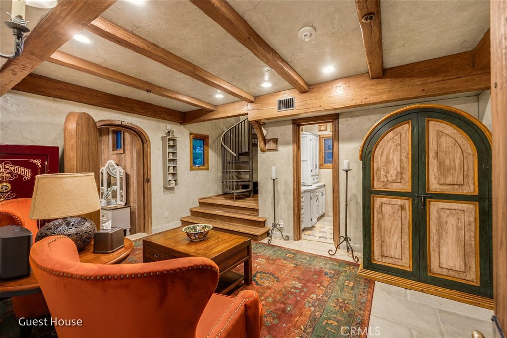 29162 Bald Eagle Ridge Road Lake Arrowhead, CA 92352 - Photo 55 of 69 a living room with furniture ceiling fan and a rug