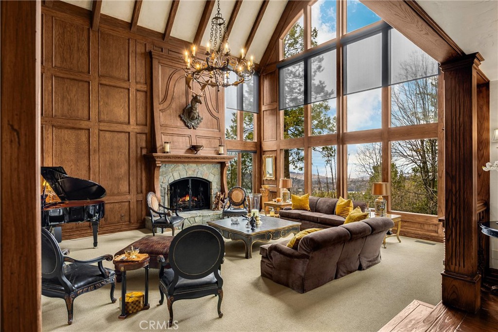 29162 Bald Eagle Ridge Road Lake Arrowhead, CA 92352 - Photo 6 of 69 a living room with furniture a fireplace and a floor to ceiling window
