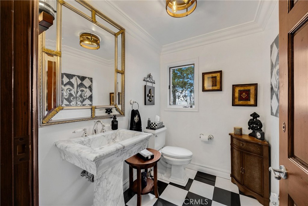 29162 Bald Eagle Ridge Road Lake Arrowhead, CA 92352 - Photo 9 of 69 a bathroom with a sink and a mirror