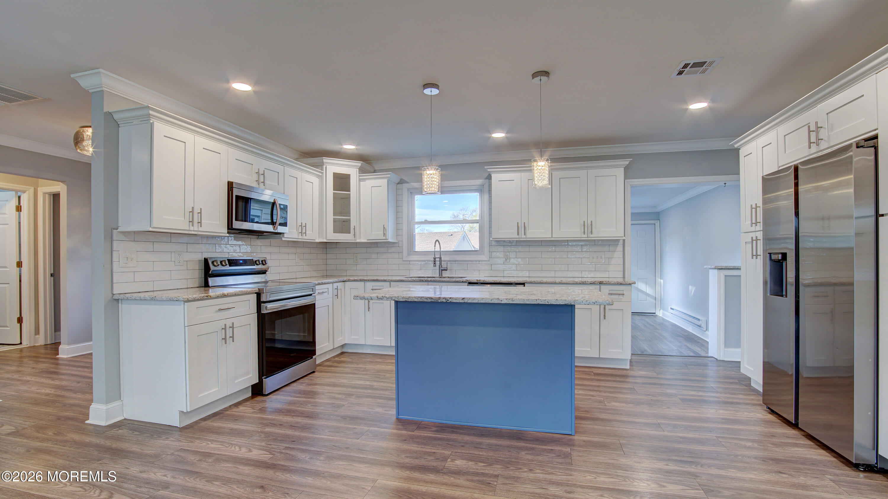 10 Zacatin Road, Unit B Freehold, NJ 07728 - Photo 12 of 39 a kitchen with stainless steel appliances granite countertop a stove top oven a sink and a refrigerator