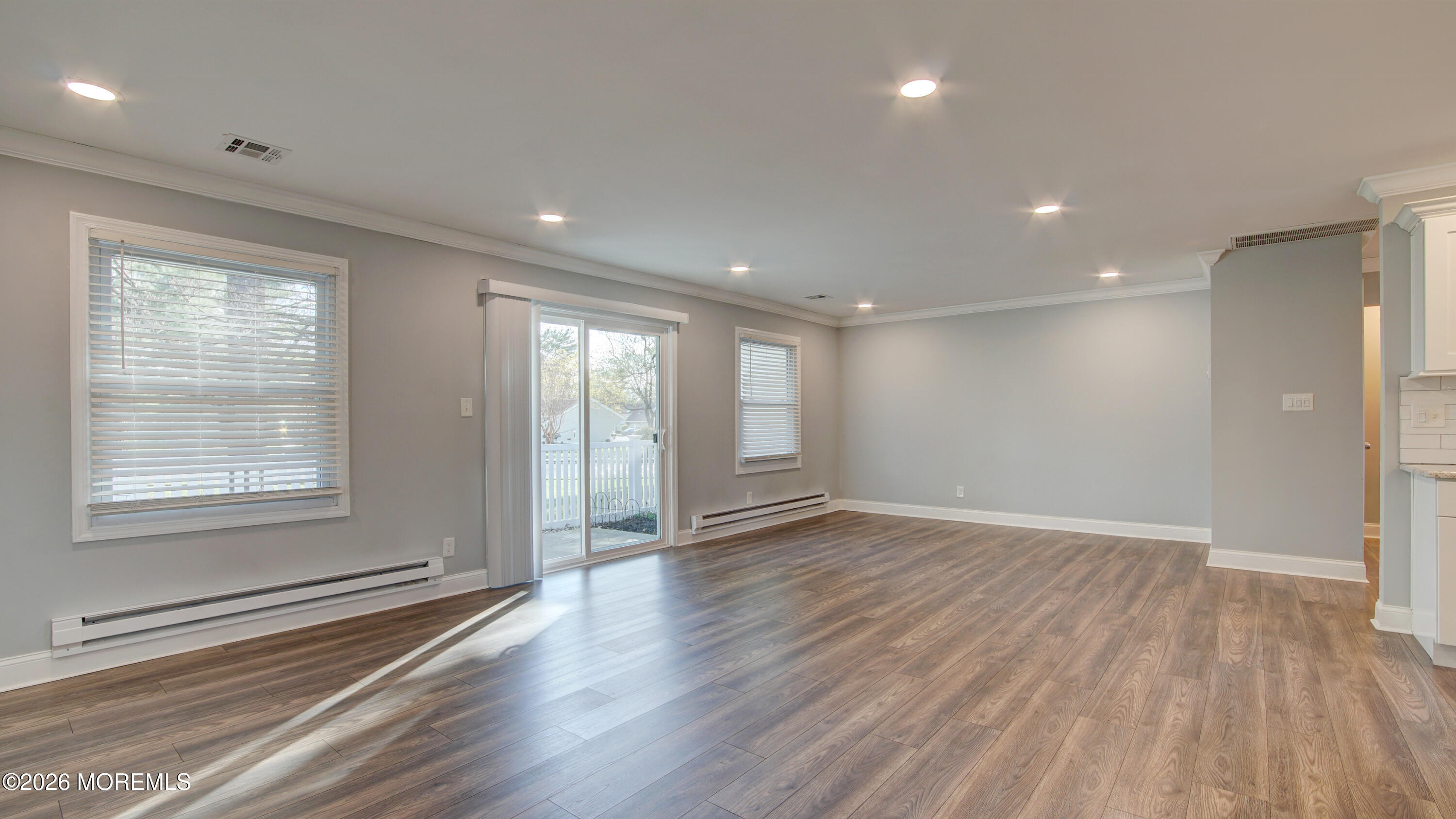 10 Zacatin Road, Unit B Freehold, NJ 07728 - Photo 16 of 39 a view of an empty room with wooden floor and a window