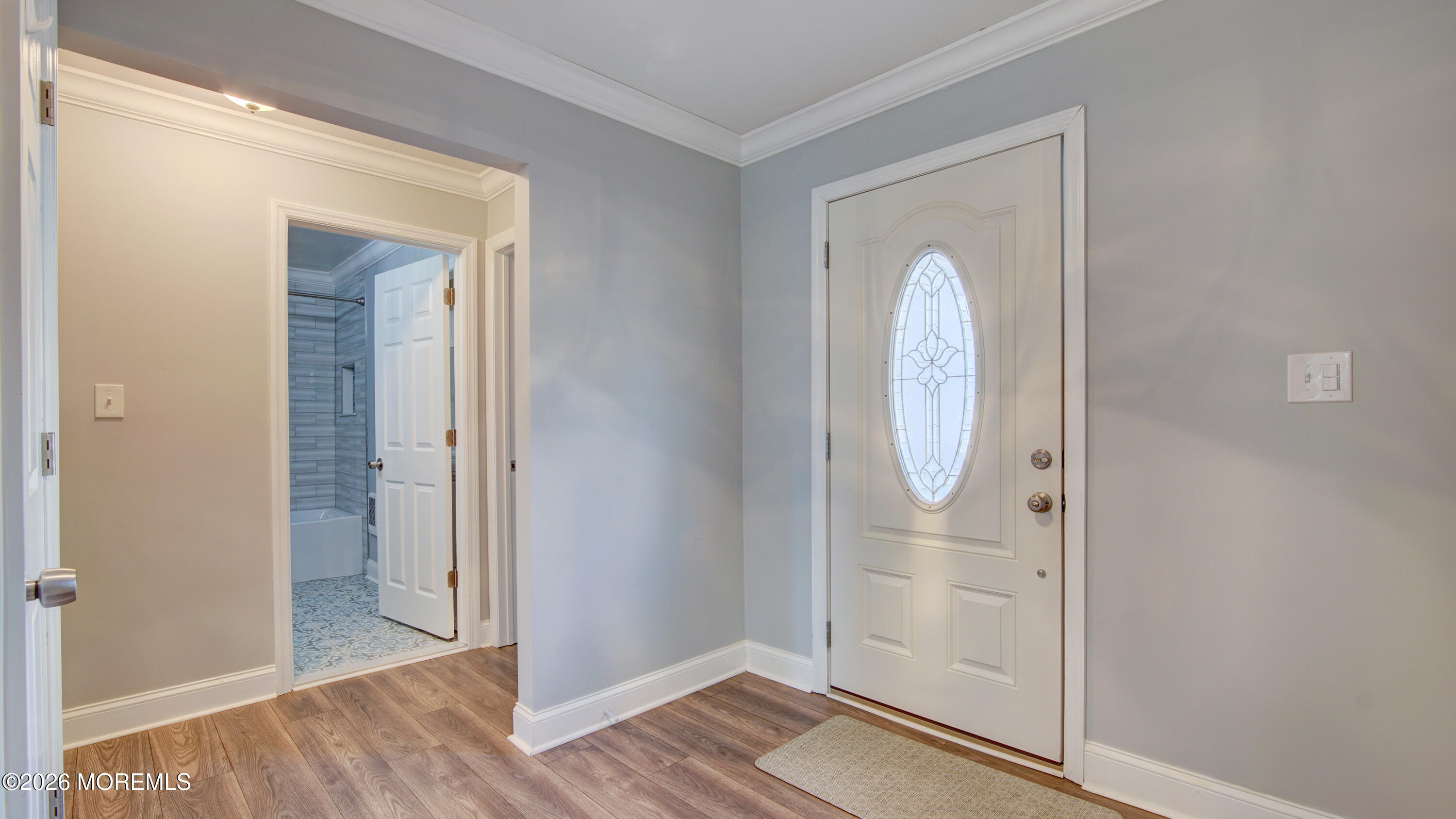 10 Zacatin Road, Unit B Freehold, NJ 07728 - Photo 18 of 39 an empty room with wooden floor mirror and window