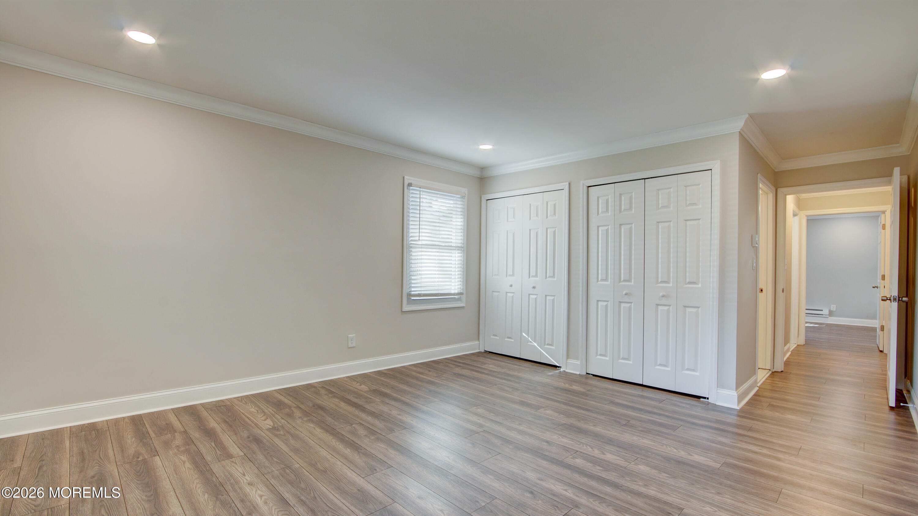 10 Zacatin Road, Unit B Freehold, NJ 07728 - Photo 19 of 39 wooden floor in an empty room with a window