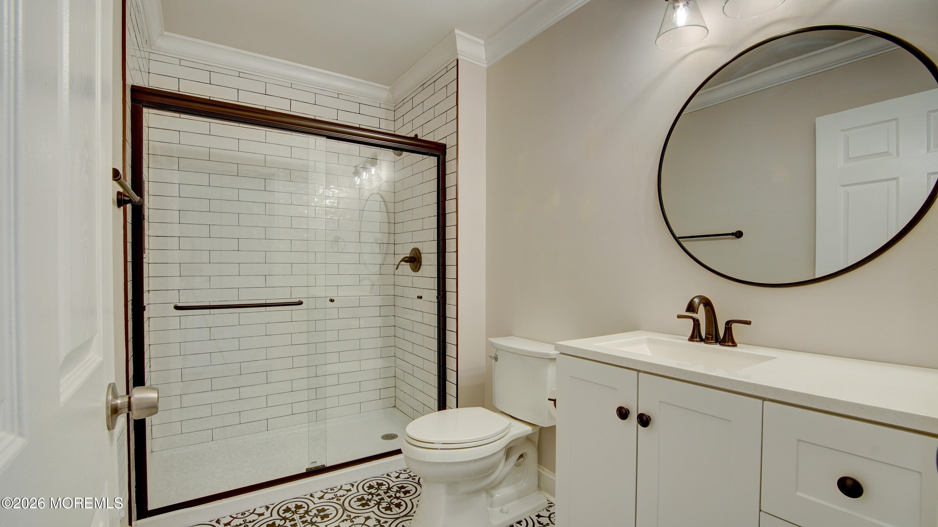 10 Zacatin Road, Unit B Freehold, NJ 07728 - Photo 20 of 39 a bathroom with a sink a toilet and a mirror