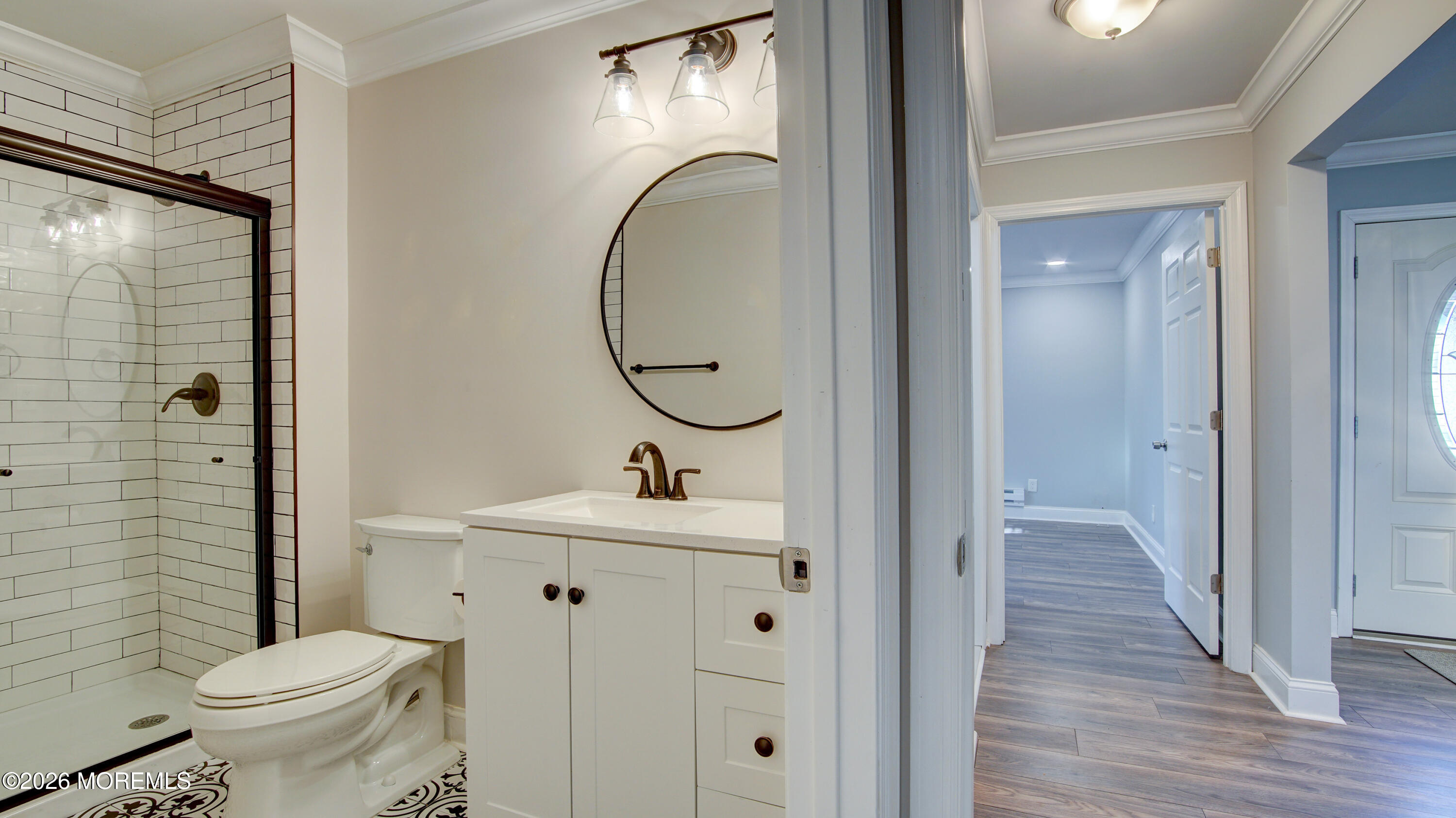 10 Zacatin Road, Unit B Freehold, NJ 07728 - Photo 21 of 39 a bathroom with a sink a toilet and a mirror