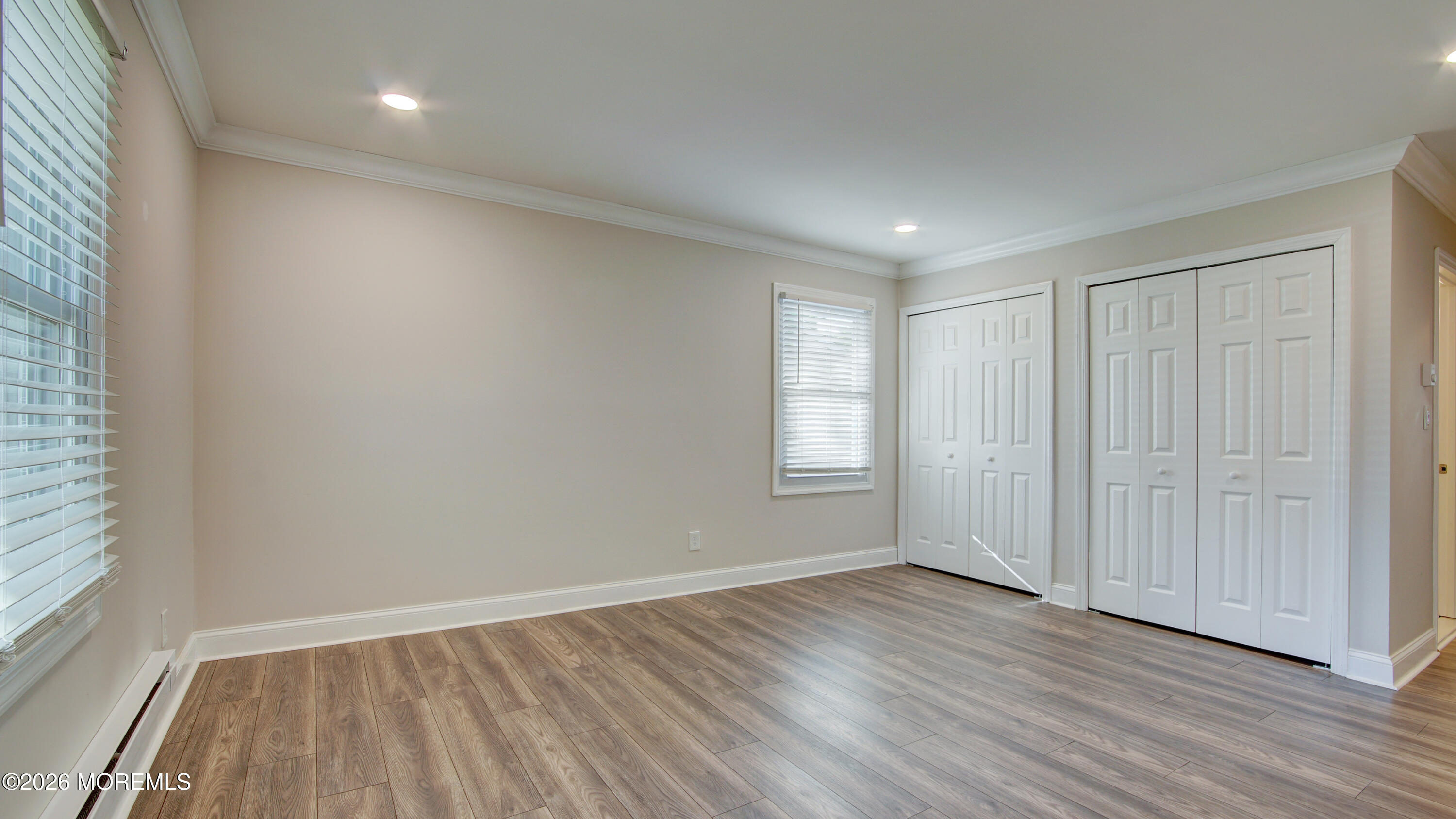 10 Zacatin Road, Unit B Freehold, NJ 07728 - Photo 22 of 39 wooden floor in an empty room with a window