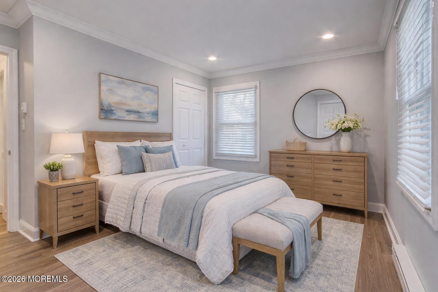 10 Zacatin Road, Unit B Freehold, NJ 07728 - Photo 23 of 39 a bedroom with a bed mirror and a window