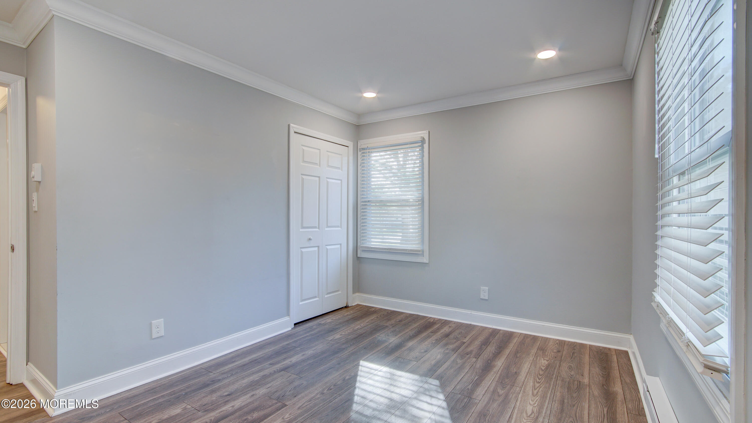 10 Zacatin Road, Unit B Freehold, NJ 07728 - Photo 24 of 39 a view of empty room with wooden floor and fan