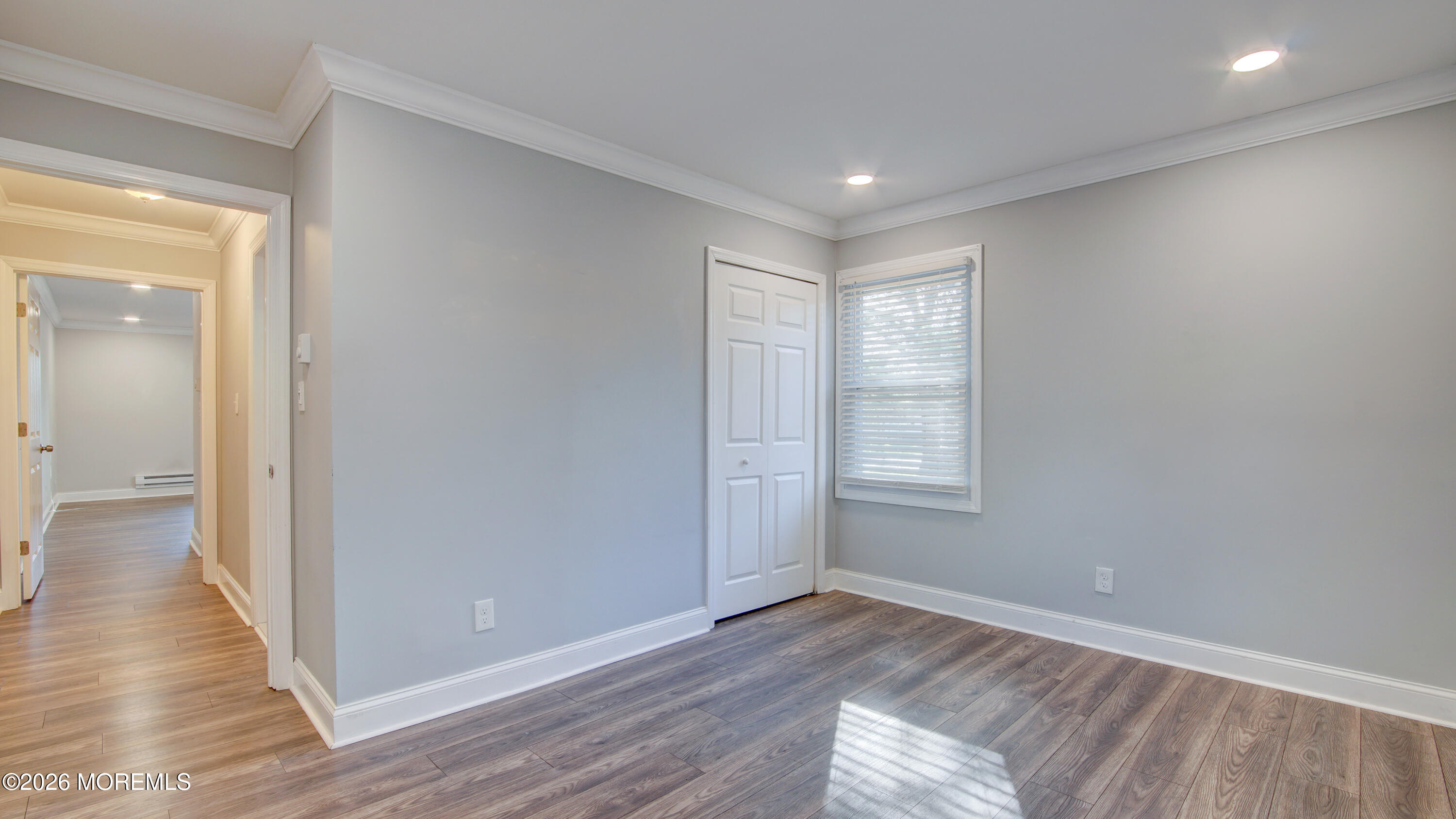 10 Zacatin Road, Unit B Freehold, NJ 07728 - Photo 25 of 39 a view of empty room with wooden floor