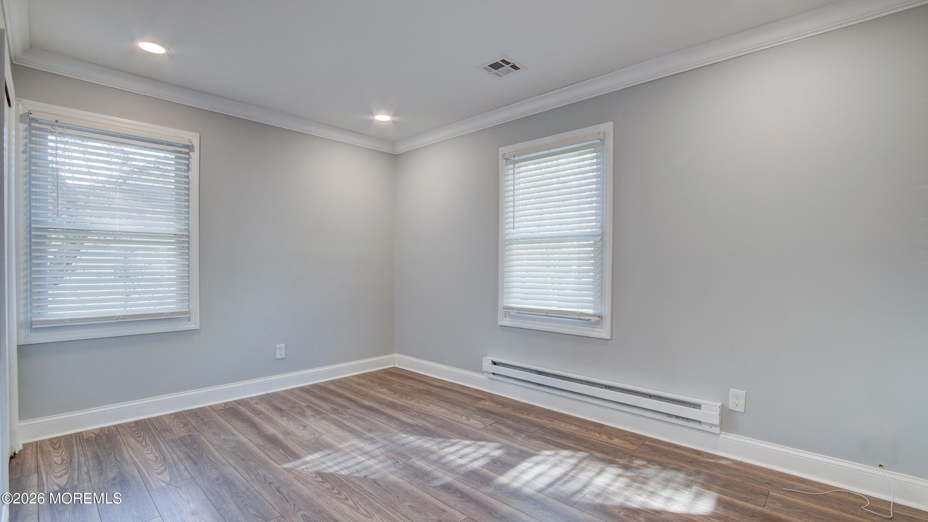 10 Zacatin Road, Unit B Freehold, NJ 07728 - Photo 26 of 39 a view of empty room with wooden floor and fan