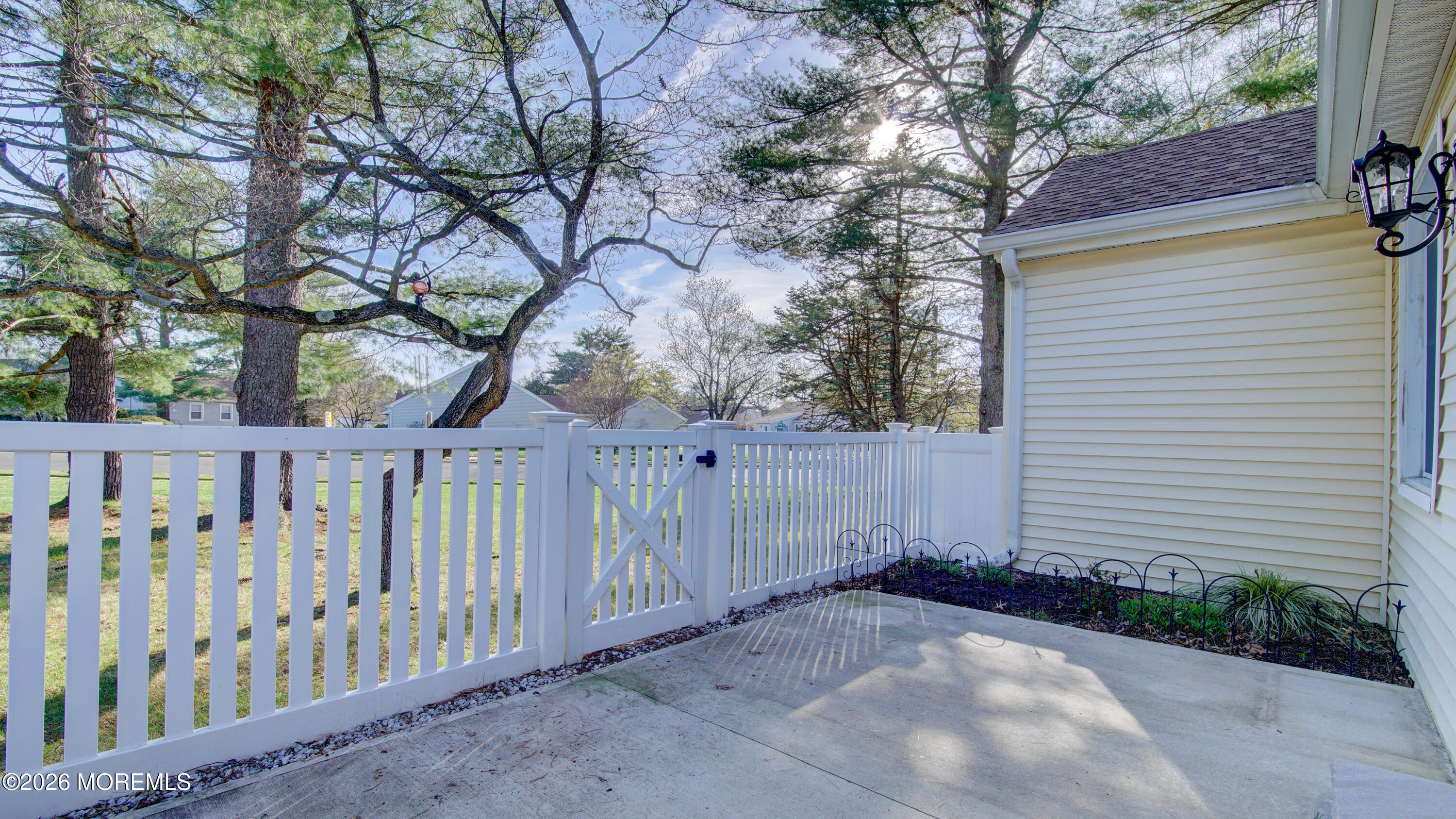 10 Zacatin Road, Unit B Freehold, NJ 07728 - Photo 39 of 39 a view of a wooden fence under a large tree