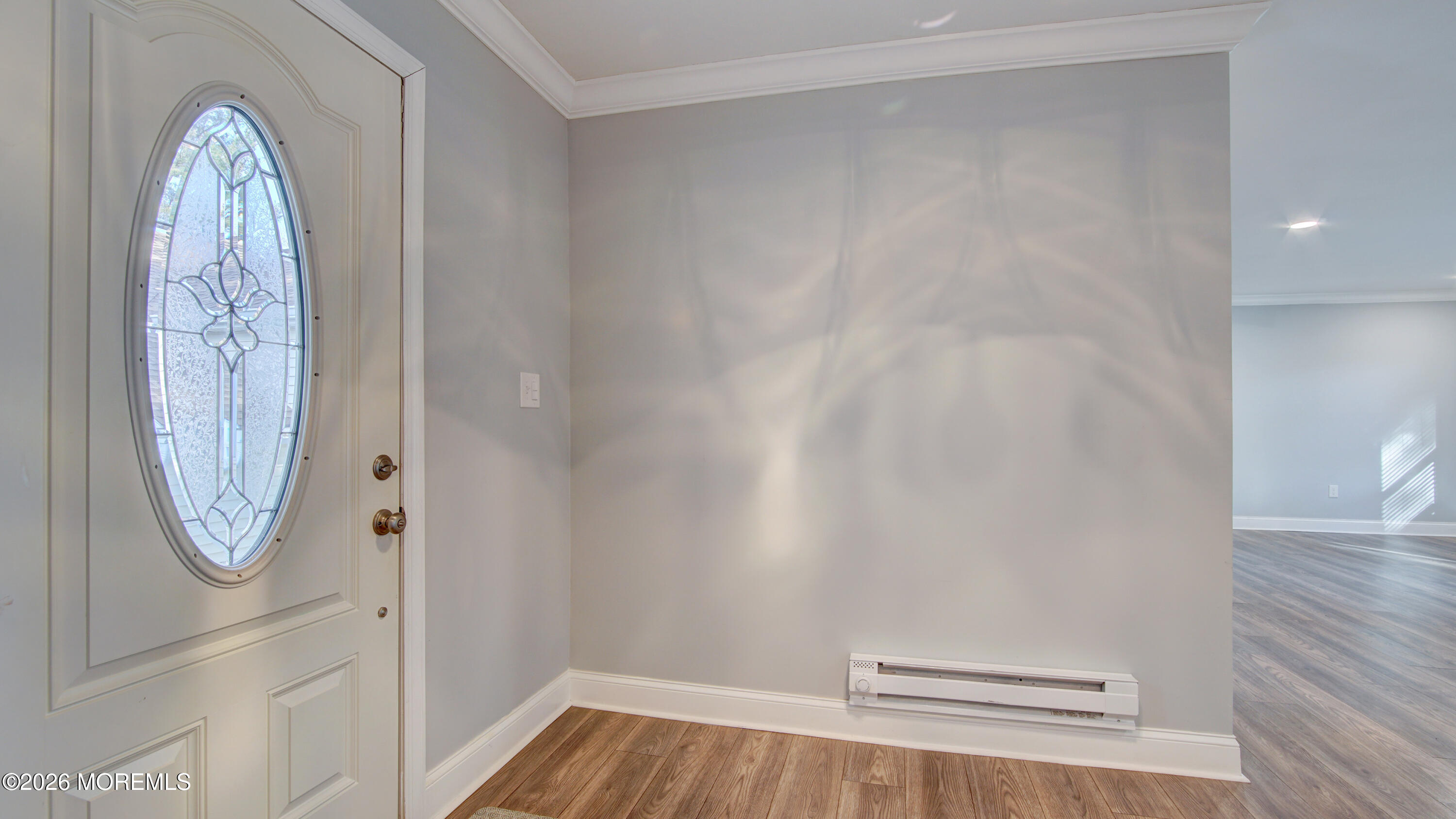 10 Zacatin Road, Unit B Freehold, NJ 07728 - Photo 5 of 39 a view of empty room with wooden floor and fan
