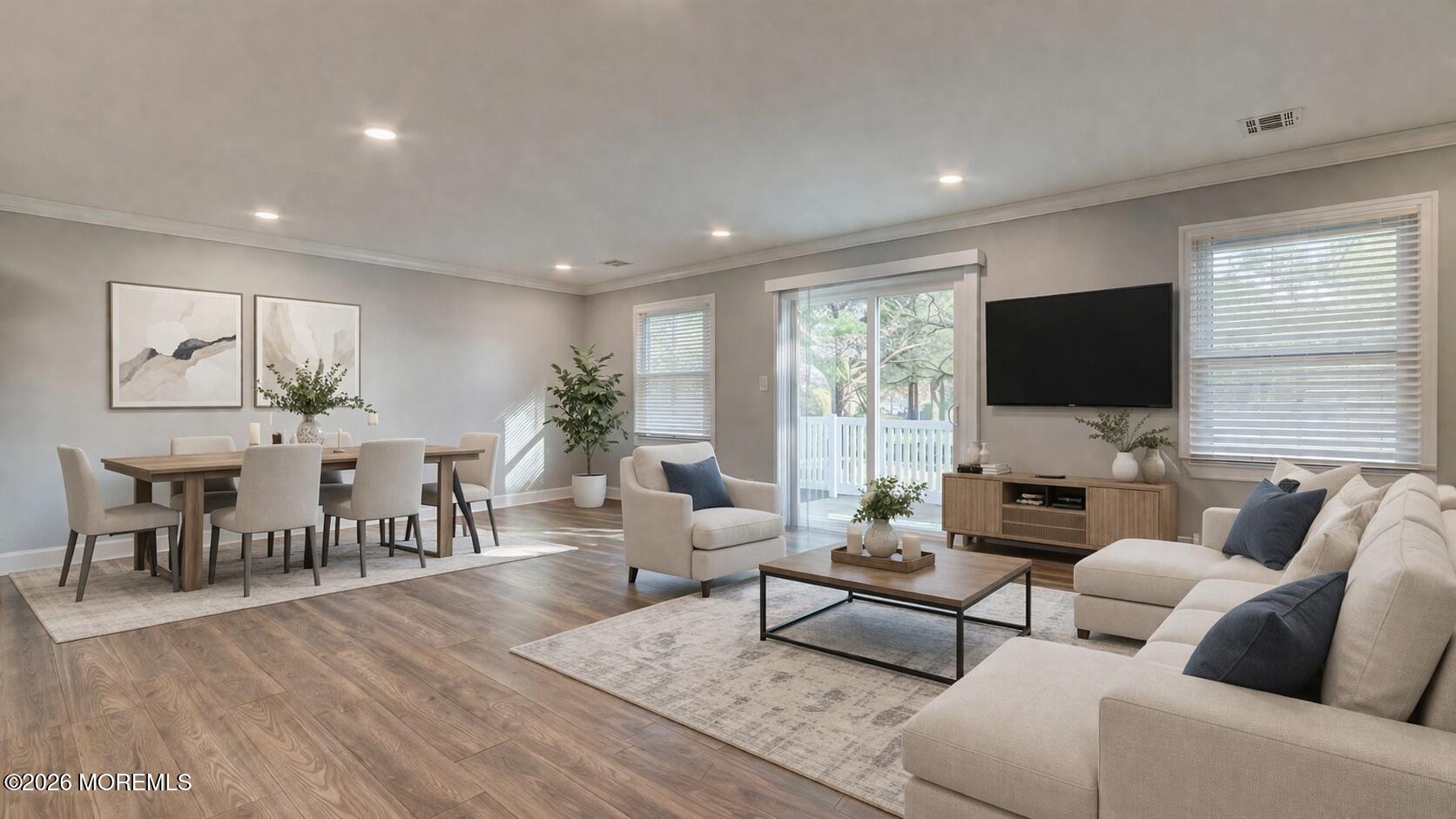 10 Zacatin Road, Unit B Freehold, NJ 07728 - Photo 8 of 39 a living room with furniture and a flat screen tv