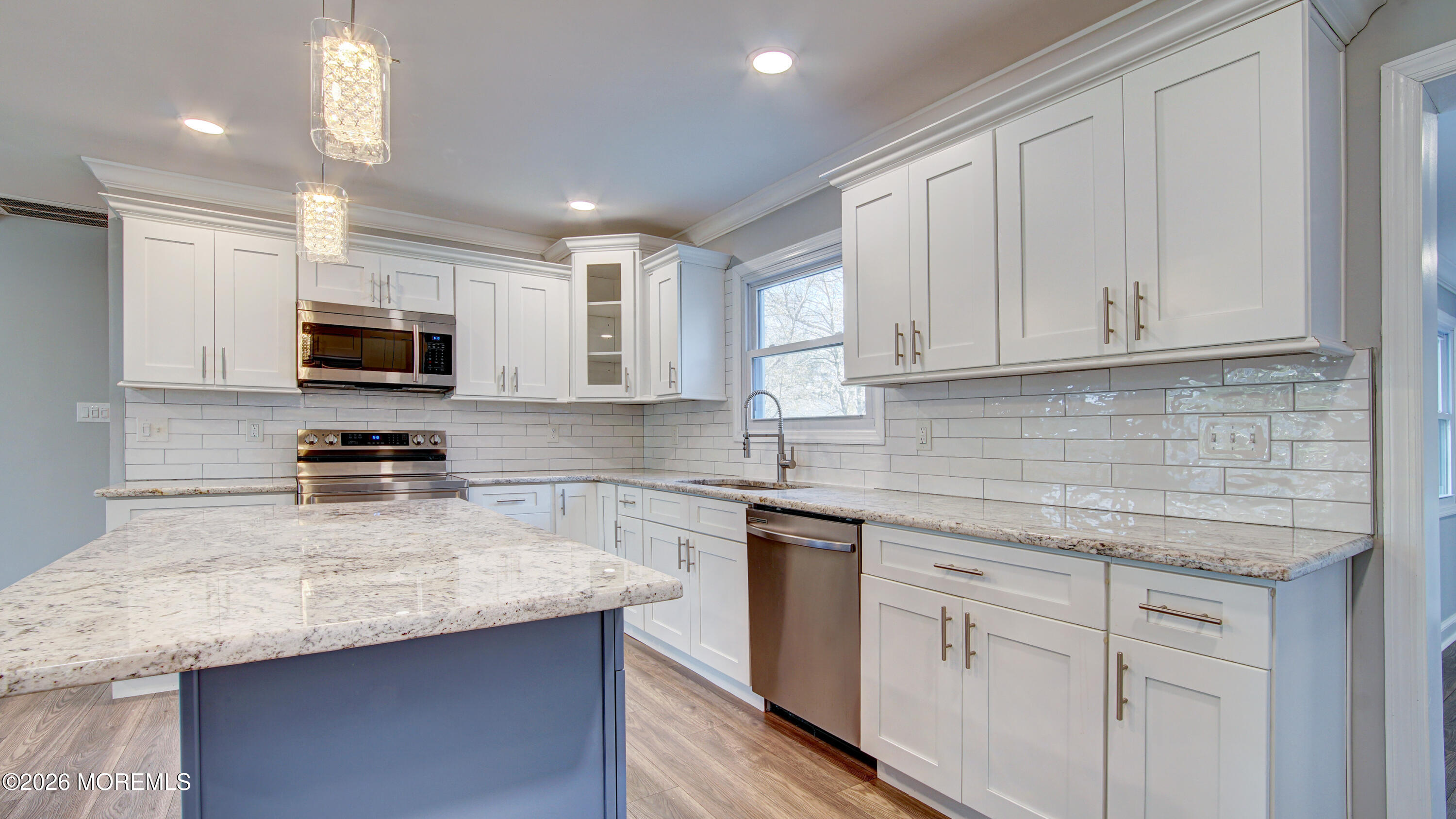 10 Zacatin Road, Unit B Freehold, NJ 07728 - Photo 10 of 39 a kitchen with granite countertop a sink and stainless steel appliances