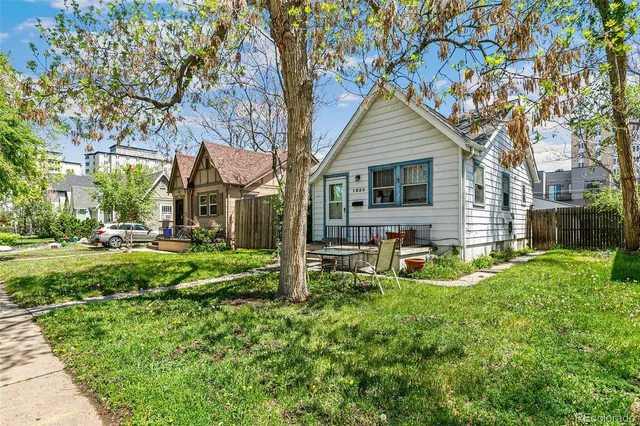 a front view of house with yard and seating area