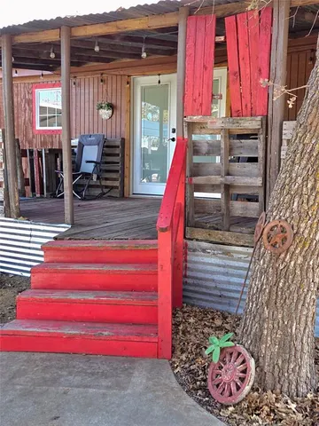 a view of front door with outdoor seating