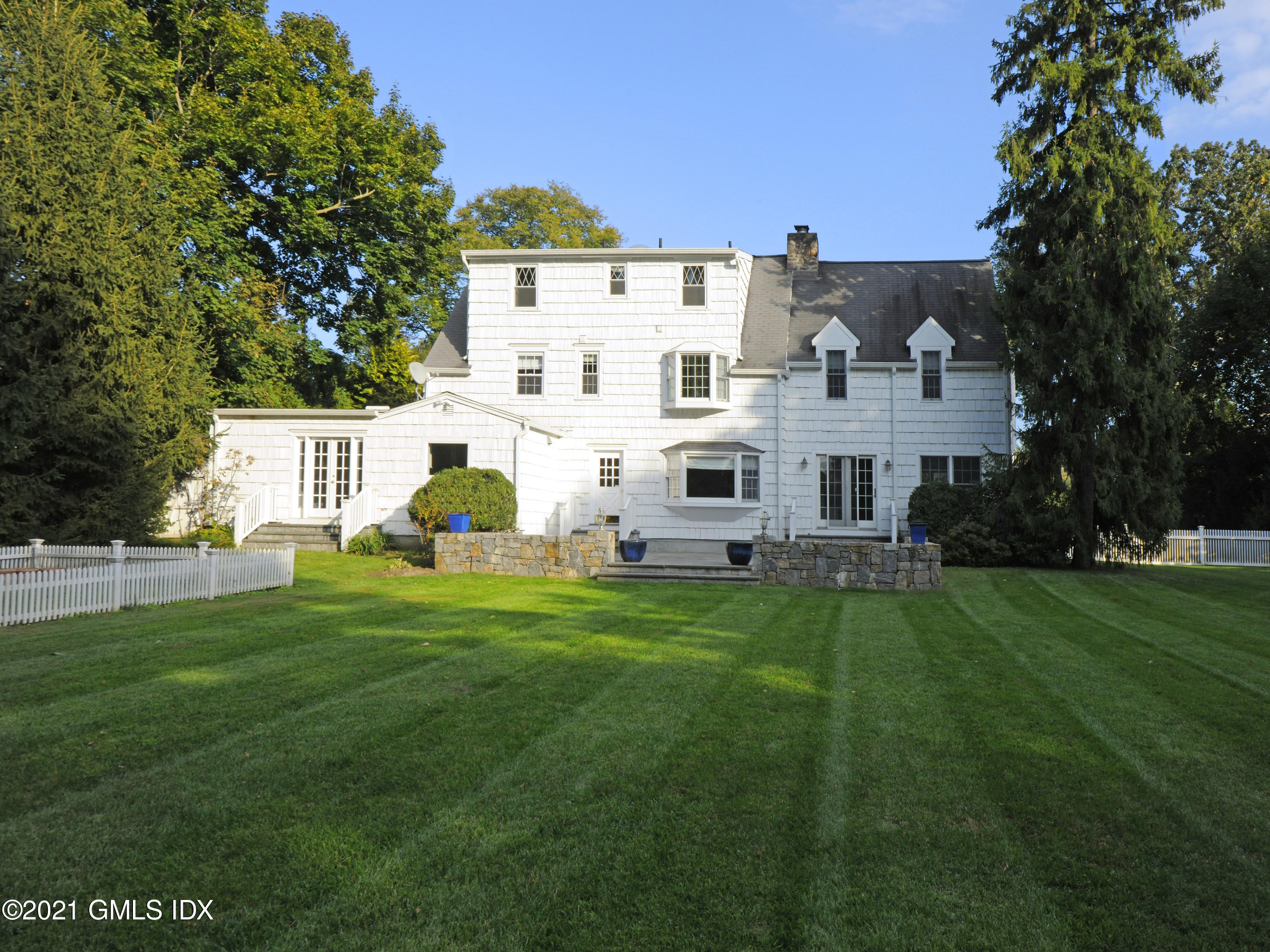 3 Random Road Old Greenwich, CT 06870 - Photo 1 of 28 a view of a white house with a yard