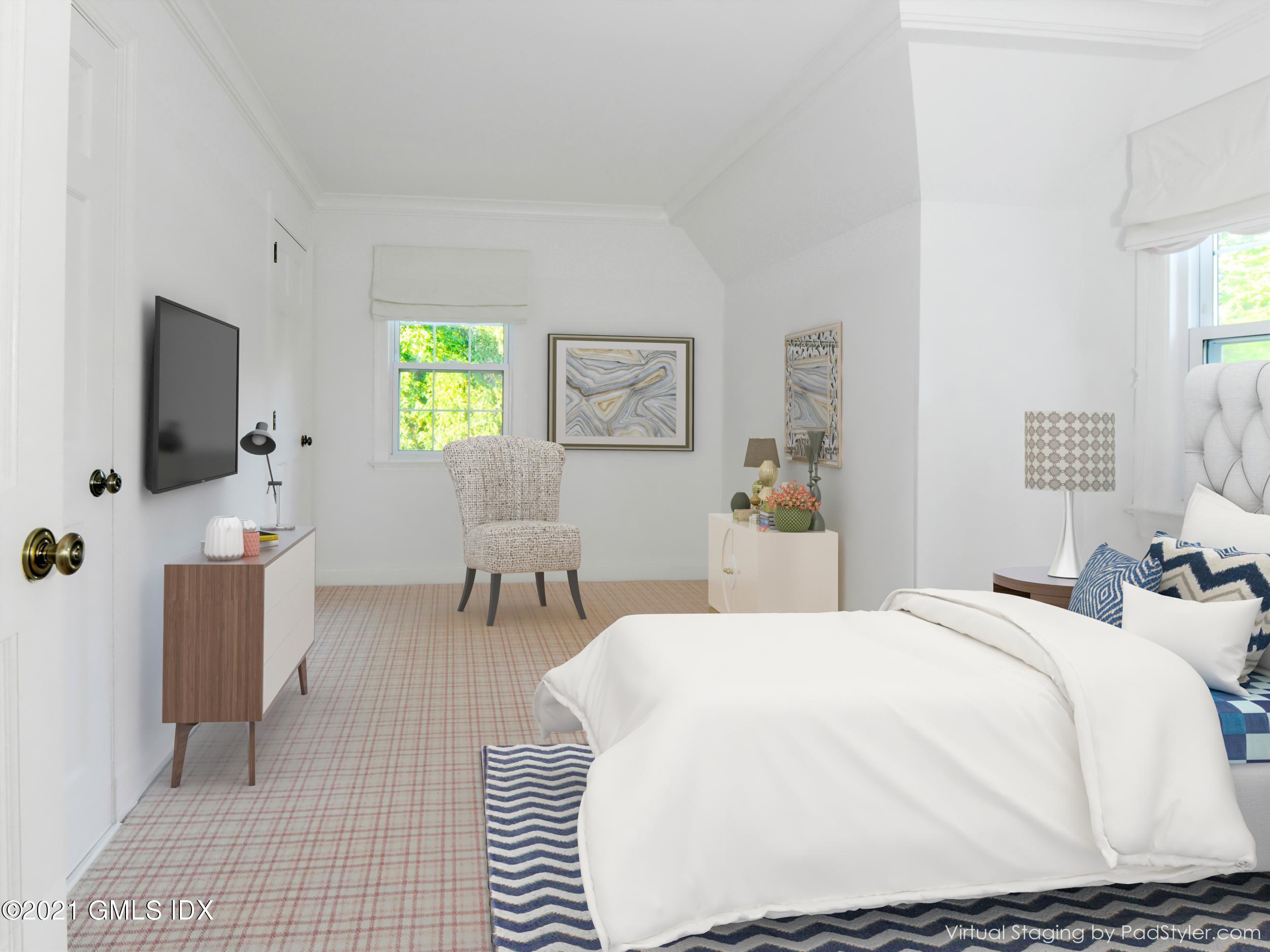 3 Random Road Old Greenwich, CT 06870 - Photo 17 of 28 a bedroom with a bed and a flat screen tv