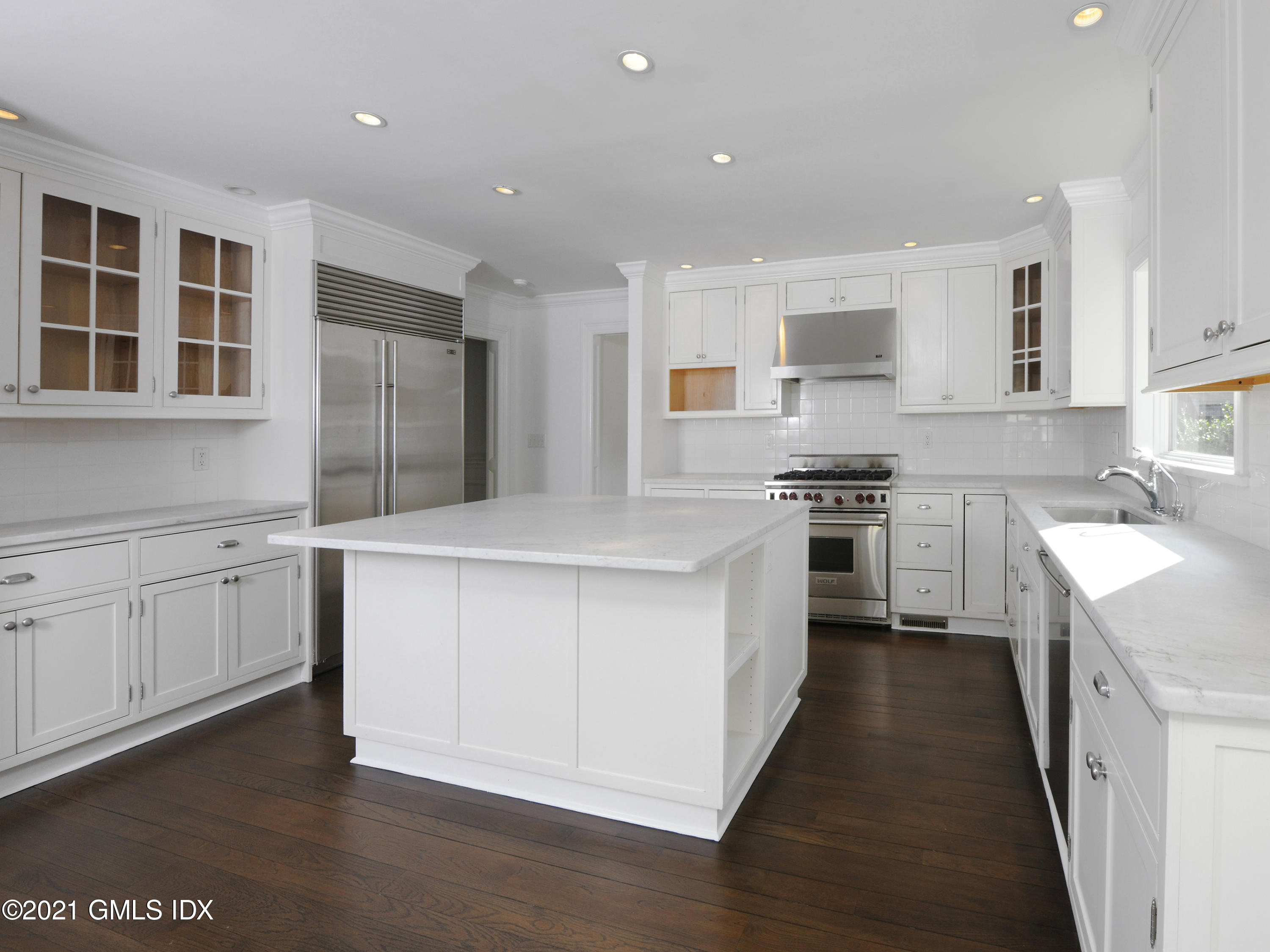3 Random Road Old Greenwich, CT 06870 - Photo 8 of 28 a kitchen with stainless steel appliances kitchen island granite countertop a stove a sink and a refrigerator
