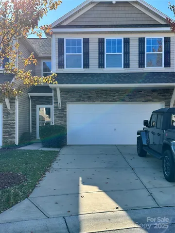 a front view of a house with yard
