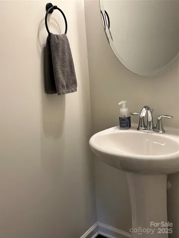 a bathroom with a sink and mirror