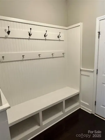 a view of cabinets with racks on the wall