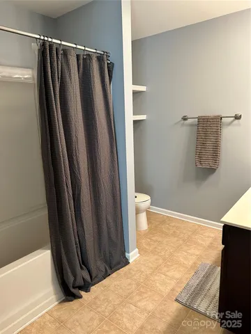 a bathroom with a shower and a tub