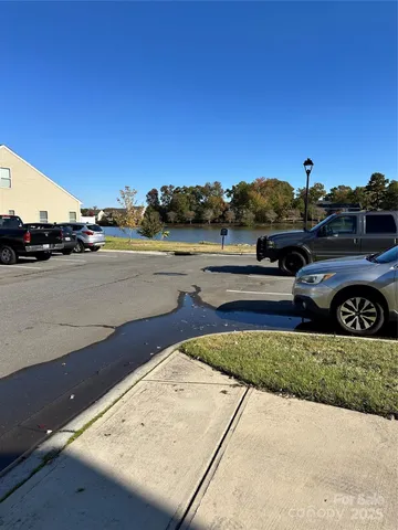 a view of a swimming pool with a yard