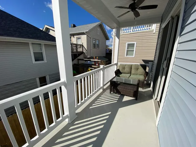 a view of balcony with furniture