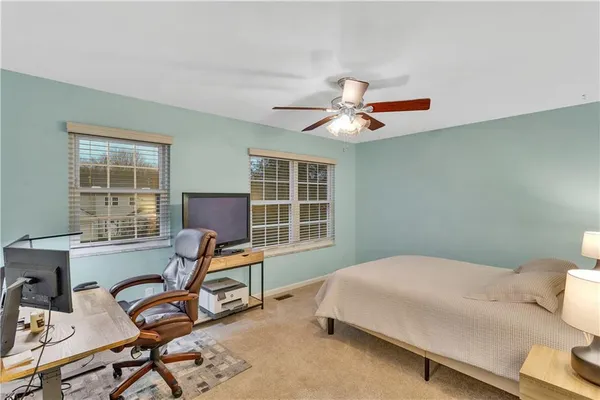 a work room with furniture and windows