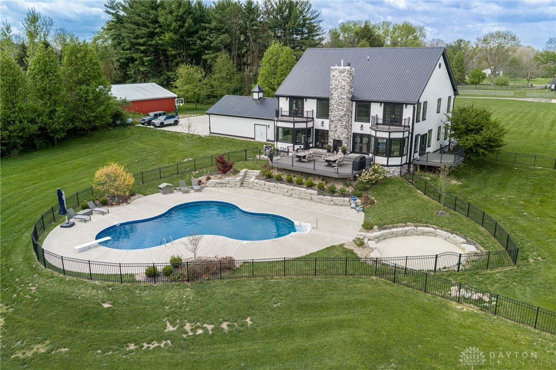 9586 Ferry Road Waynesville, OH 45068 - Photo 25 of 40 This expansive estate features a captivating swimming pool, private yard, and impressive two-story home.