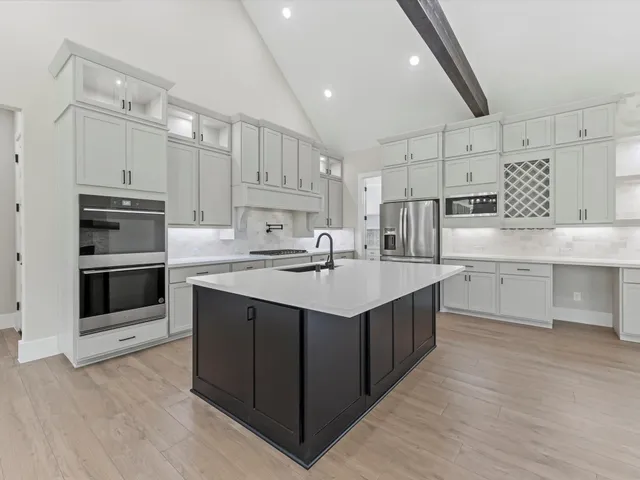 a view of cabinets with wooden floor and entryway