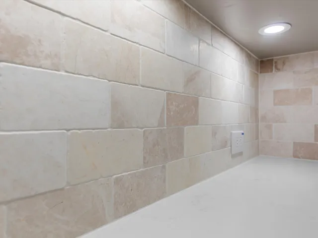 a bedroom with bed and a potted plant