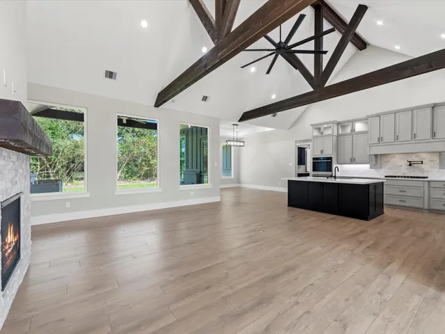 a kitchen with stainless steel appliances a sink stove and cabinets