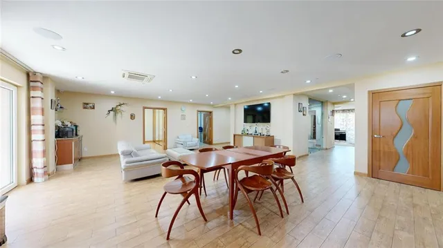 a living room with furniture and a rug