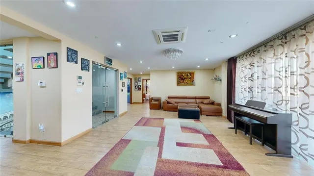 a living room with furniture and a rug