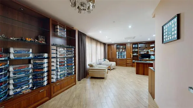 a workspace with furniture and a wooden floor