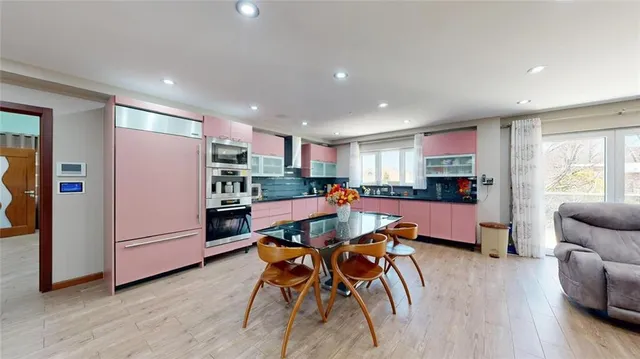 a bathroom with a bathtub a sink and a mirror