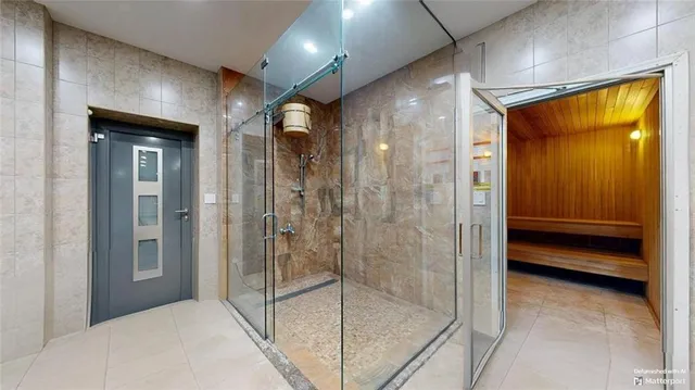 a bathroom with a sink a mirror and a shower
