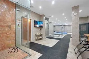 a view of kitchen island with tub and wooden floor