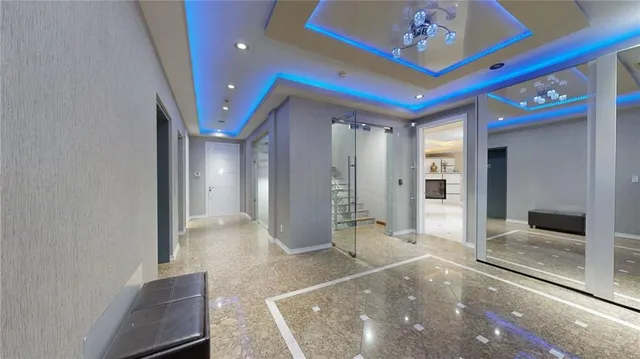 a view of a hallway with a chandelier