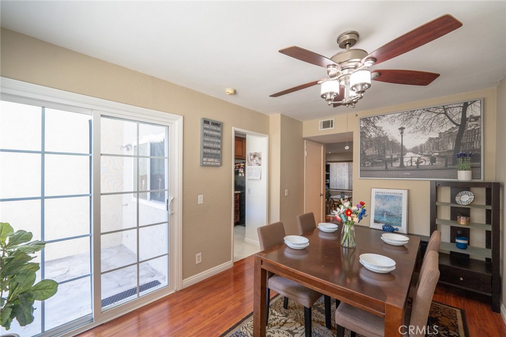 45 Oval Irvine, CA 92604 - Photo 3 of 40 a view of a dining room with furniture a chandelier and wooden floor
