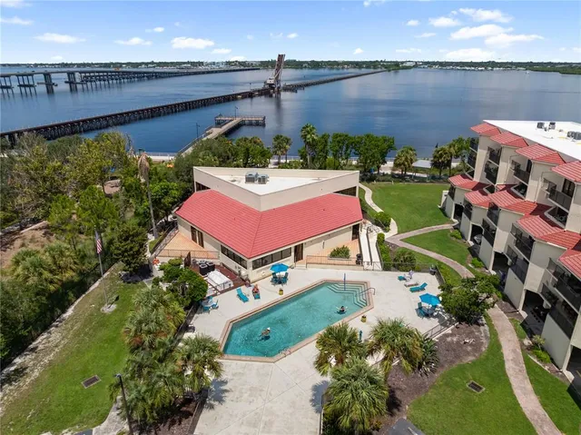 a view of a chair and tables in the balcony