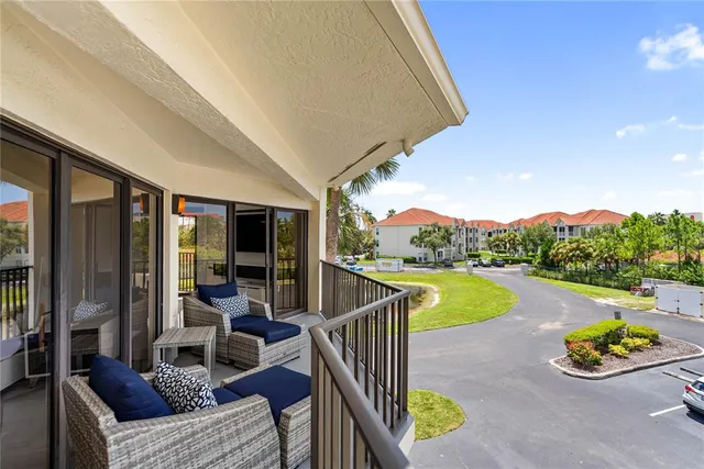 an outdoor space with wooden floor and city view