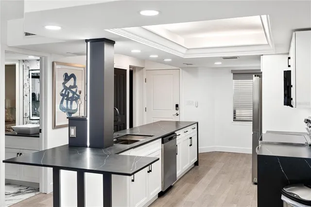 a living room with furniture and large windows